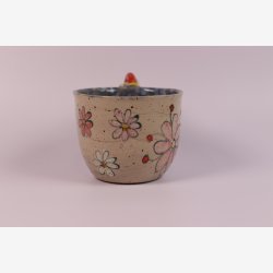 Krus med blomst